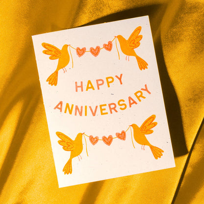 Colorful Risograph greeting card featuring anniversary birds design by Bromstad Printing Co. for special occasion notes.