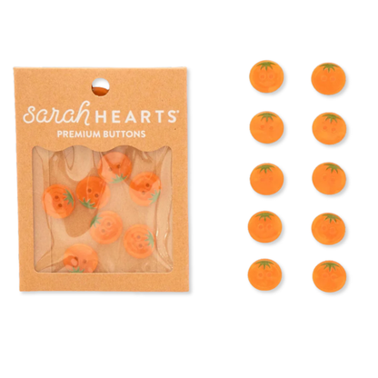 Small orange heirloom tomato-shaped buttons by Sarah Hearts for accessories, featuring vibrant 5/8-inch tomato designs.