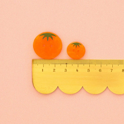 Orange heirloom tomato small 5/8 inch buttons, accessories by Sarah Hearts, featuring vibrant orange tomato-shaped embellishments.