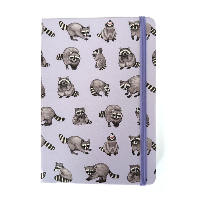 Hardcover Rambunctious Raccoons dot grid journal by Allison Stoiser Art, featuring raccoon illustrations on the cover.