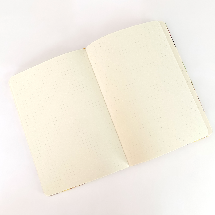 Rambunctious Raccoons hardcover dot grid journal by Allison Stoiser Art, featuring colorful raccoon illustrations on the cover.