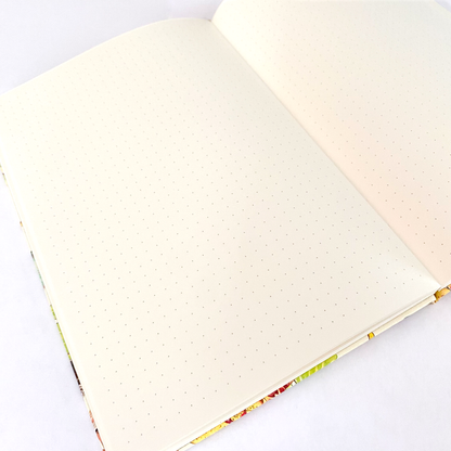 Hardcover Rambunctious Raccoons Dot Grid Journal by Allison Stoiser Art featuring playful raccoon illustrations on the cover.