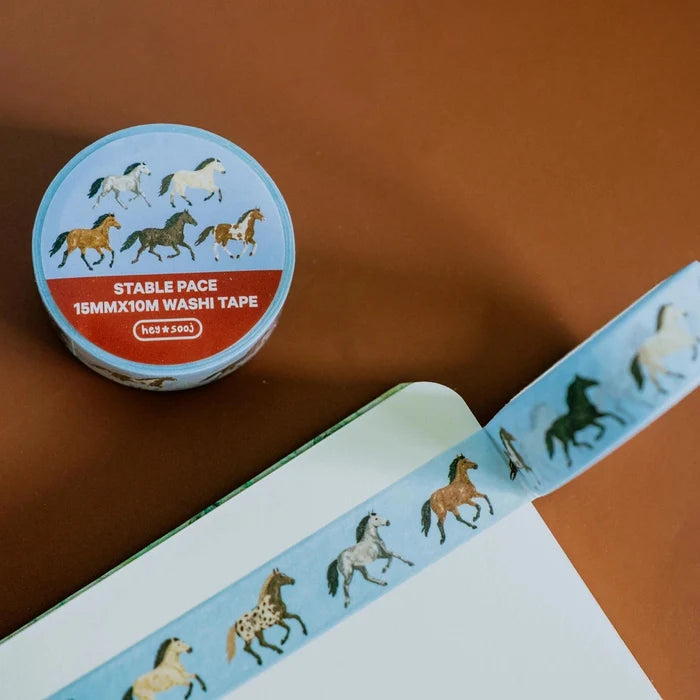 Decorative washi tape featuring running horses on blue background by hey ✿ sooj, showcasing a whimsical horse pattern.