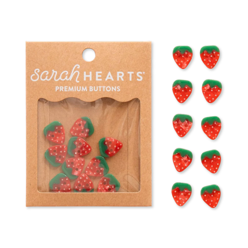 Small 5/8-inch strawberry-shaped buttons by Sarah Hearts, colorful accessories for crafting and sewing projects.