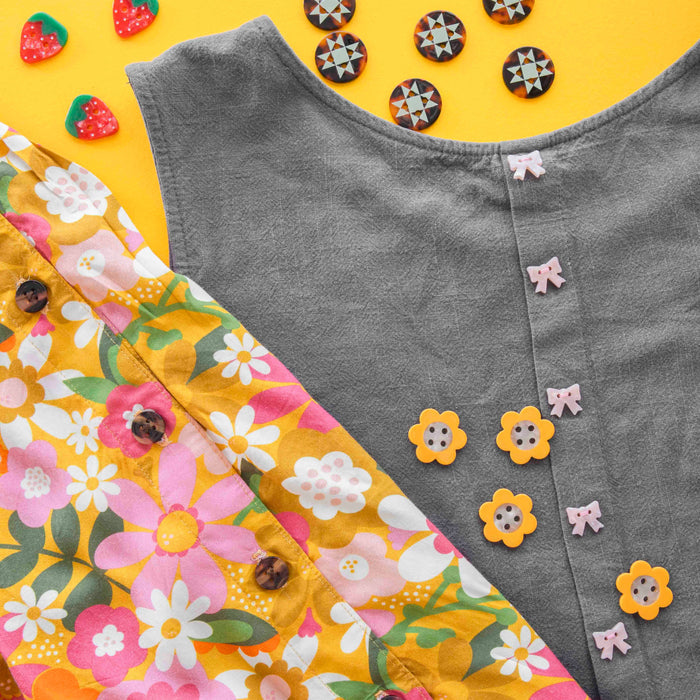 Sarah Hearts strawberry-shaped small 5/8" buttons, colorful accessories with a fun, fruity design for craft and clothing embellishments.