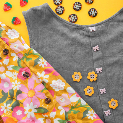 Sarah Hearts strawberry-shaped small 5/8" buttons, colorful accessories with a fun, fruity design for craft and clothing embellishments.