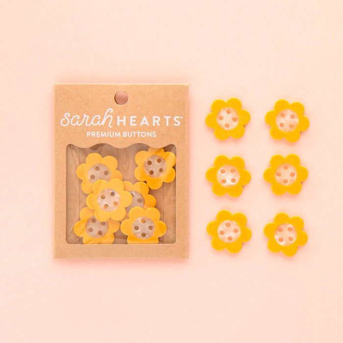 Yellow Daisy large 1-inch buttons from Sarah Hearts, colorful floral accessory with yellow petals and white centers.